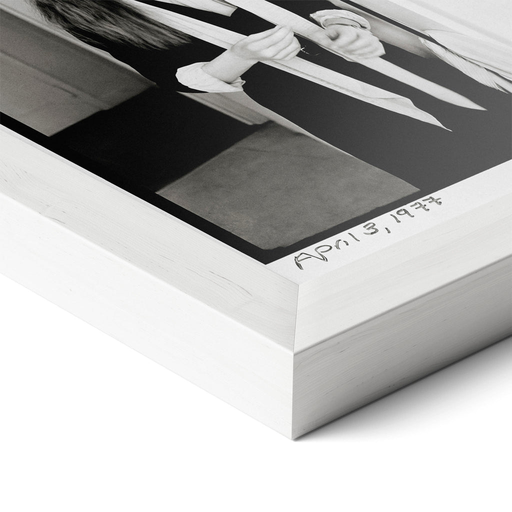 Corner close-up of the Diane Keaton black and white poster in a white frame