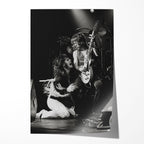 Unframed black and white print of a frontman kneeling before Randy Rhoads, Bradford 1980