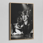 Angled view of the Randy Rhoads black and white canvas in a natural oak floating frame